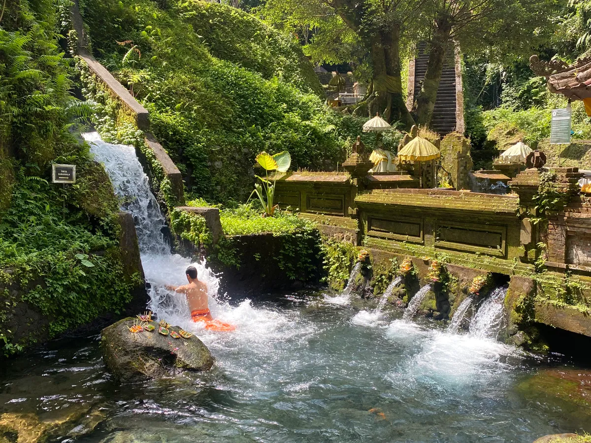 Moss-covered stone carvings at the sacred water temple