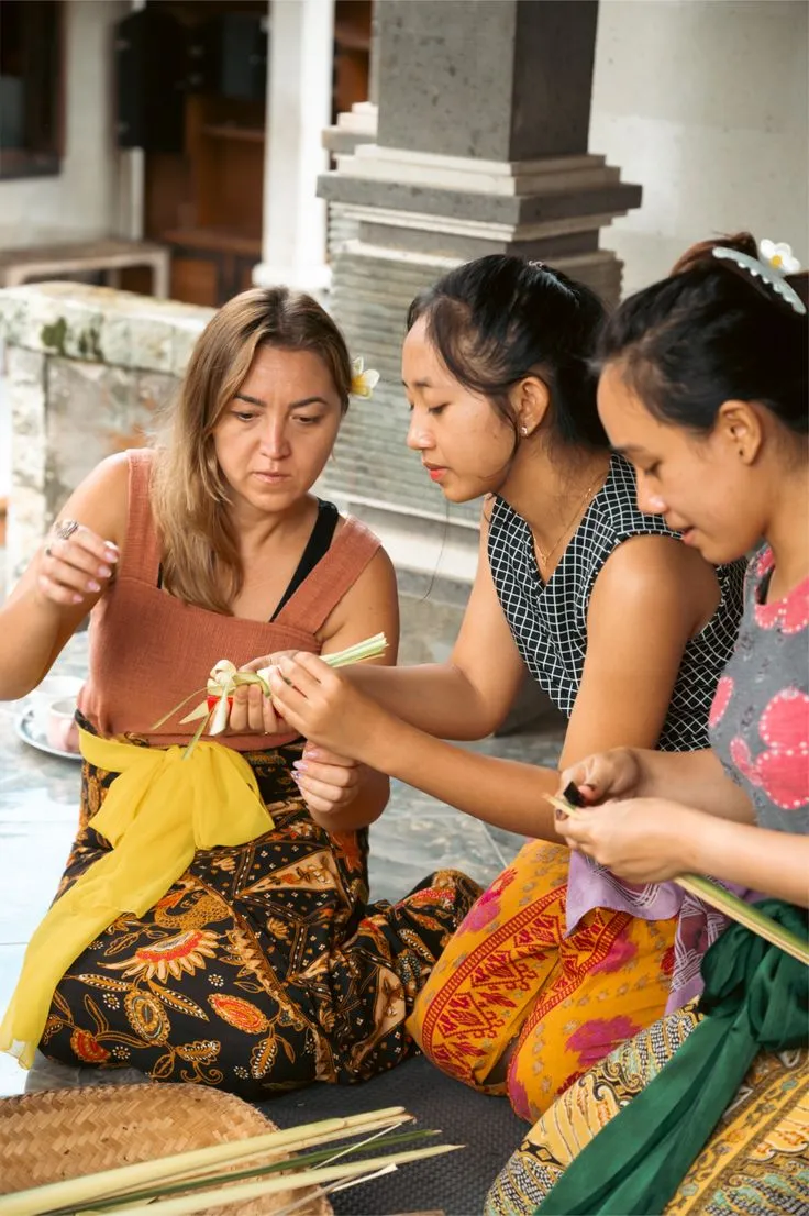 Local Balinese woman guiding the offering making process