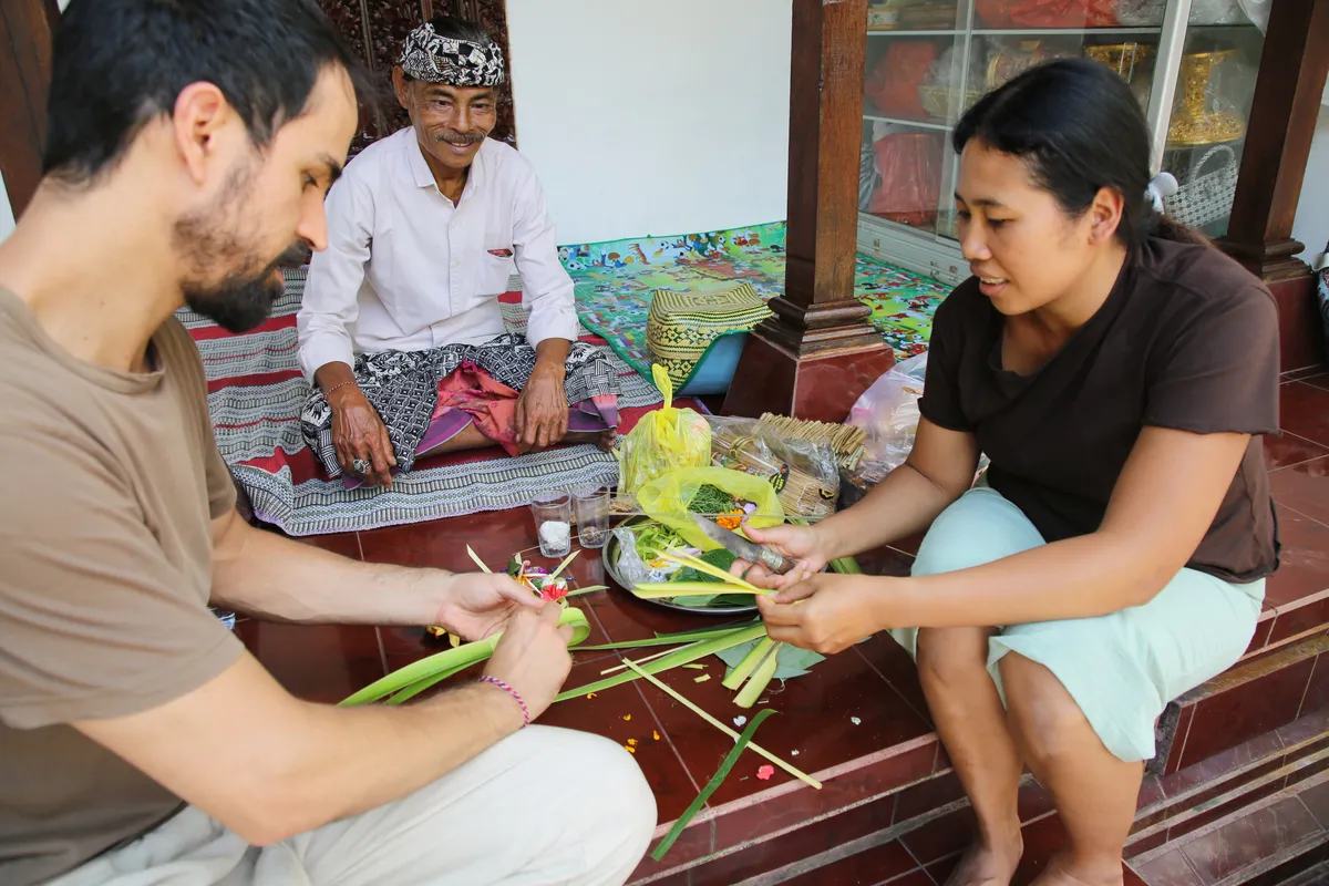 Handmade Balinese offering with frangipani flowers ready for the temple