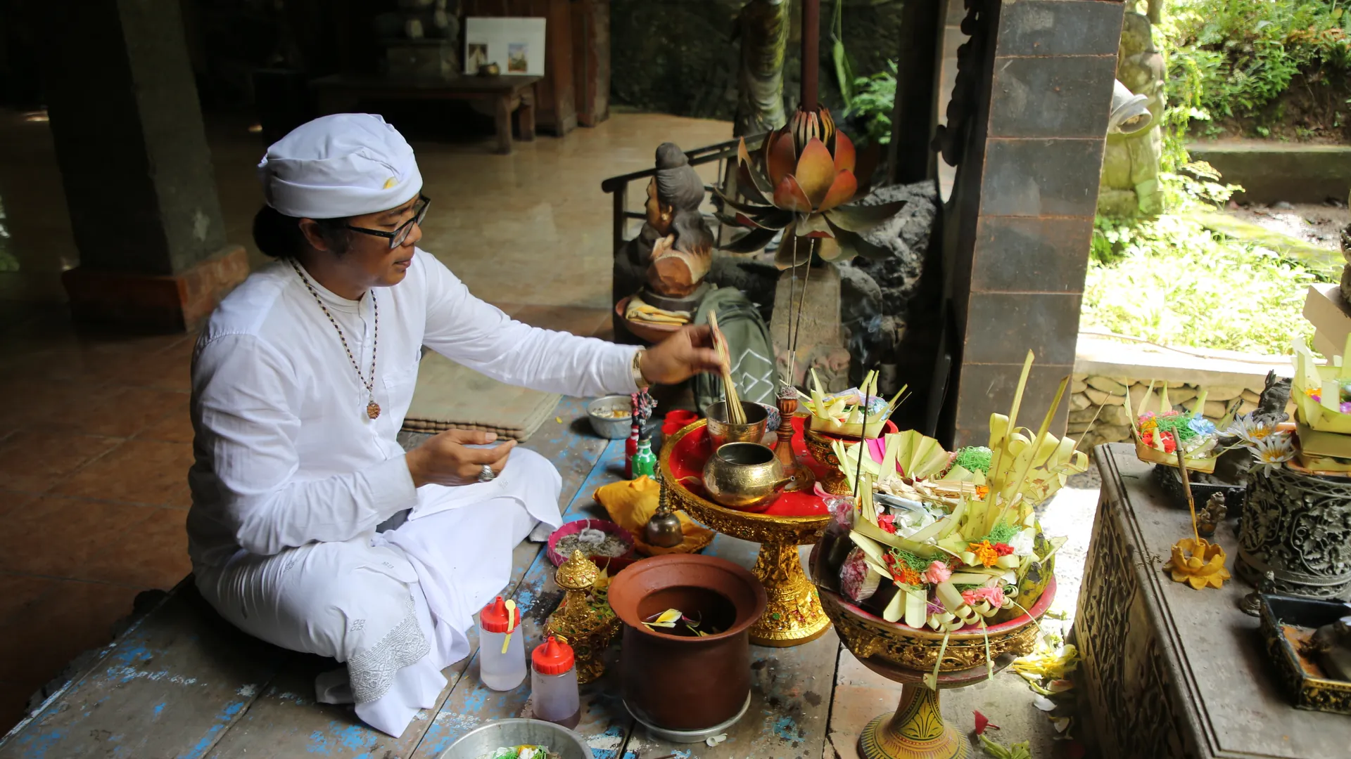 A Balinese Melukat purification ceremony in a sacred spring